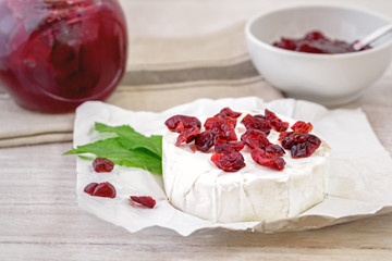 Dried cranberries on camembert cheese. 