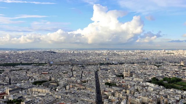 Time lapse aerial view of Paris skyline with Eglise Saint-Sulpice church and Luxembourg Palace. Blue cloudy sky on Rue de Rennes street with cars traffic at sunset in France.