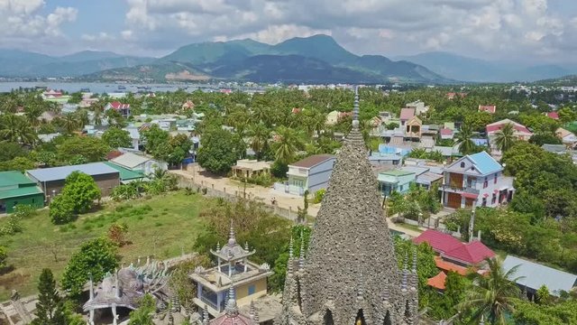 Aerial View Tropical City with Old Coral Buddhist Temple
