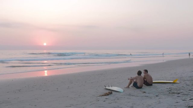 Sitting on beach at sunset
