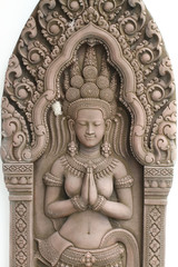 Wall engravings/relief of temple devi dancers at Angkor wat in Cambodia isolated on white backgrounds, wallpaper, home decoration crafting product