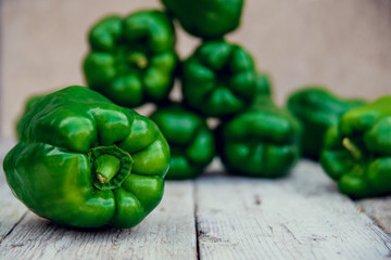 Photo of sliced colorul peppers over wooden table