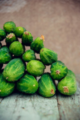 Pile of fresh organic cucumbers on a market