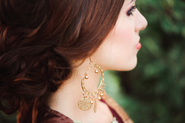 Woman Hands with black mehndi tattoo. Hands of Indian bride girl with black henna tattoos. Fashion. India