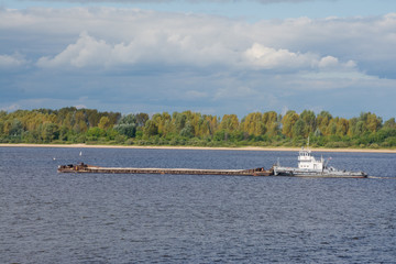 Obraz premium a cargo barge on the Volga