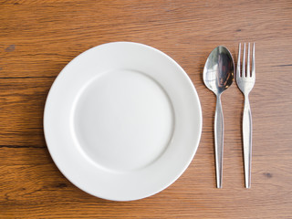 fork and spoon on white dish