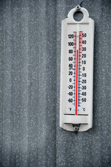 outdoor thermometer on metal siding - 169845060