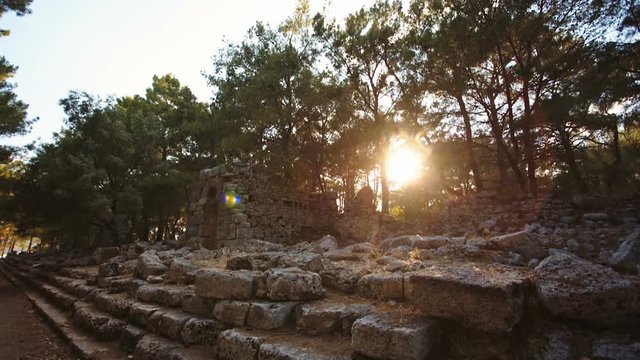 Antique ruins of an ancient fortress at sunset