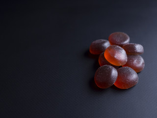 Strawberry flavoured jelly sweets from japan, isolated on black background