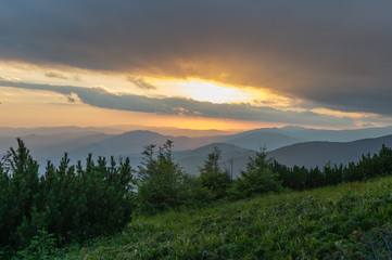 Naklejka na ściany i meble Sunset in the mountains. Travel to the mountains. Carpathians, Ukraine
