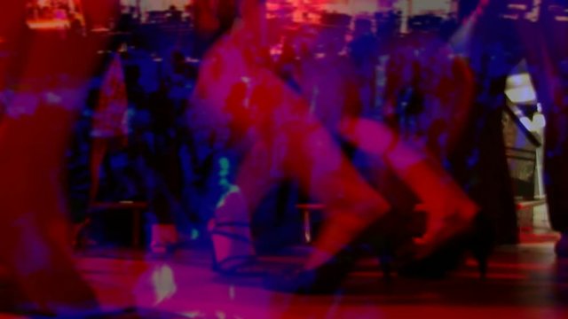 Two woman dancing at discotheque