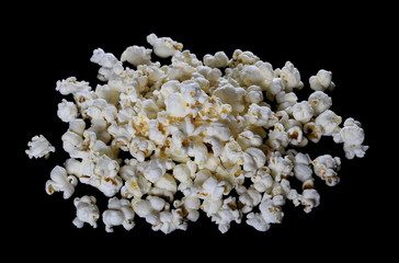 Pile popcorn isolated on black background