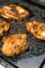 Roasted chicken on the grill pan macro. horizontal view from above