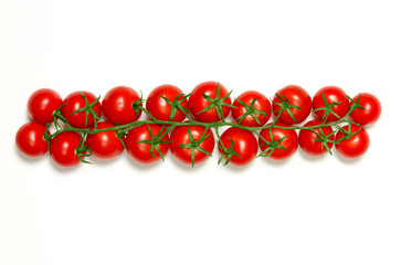 Fresh row of vine tomatoes isolated on white