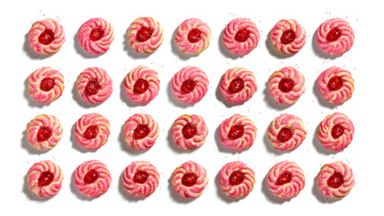 Overhead view of a colorful pattern of amaretti, cherry almond, cookies on white background