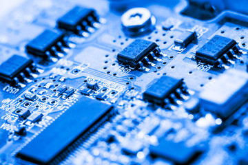 Close up of semiconductor Electronic Circuits in Technology on  
Mainboard background (Main board,cpu motherboard,logic board,system board or mobo)