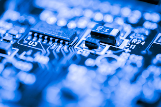 Close up of semiconductor Electronic Circuits in Technology on  
Mainboard background (Main board,cpu motherboard,logic board,system board or mobo)
