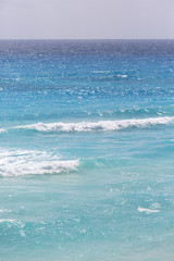 The sea. High resolution image of Caribbean sea vertically. Some waves and horizontal line.