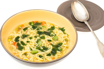 Vegetarian vegetable soup with vermicelli and spring onions
