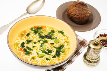 Vegetarian vegetable soup with vermicelli and spring onions