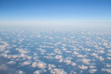 Beautiful aerial view on clouds from a plane over an Iceland. 