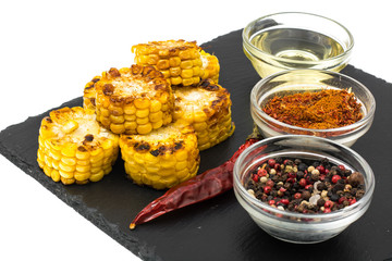 Spicy corn grill on black stone