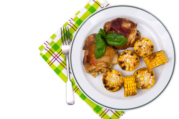 Dish of corn and turkey on grill