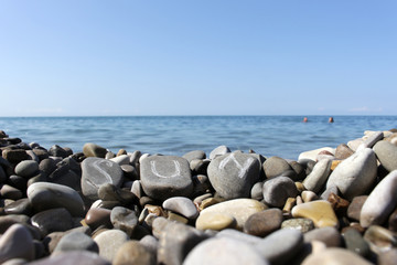 Fototapeta na wymiar the inscription on the stones the sun on the sea