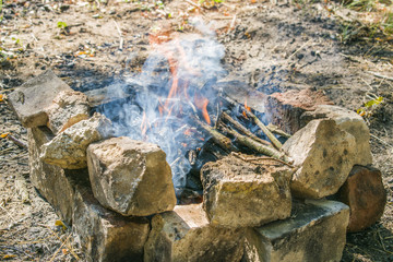 On a hot summer day, burn a fire in the forest.