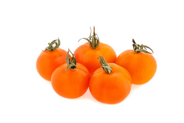 Small round tomatoes cherry on a white background