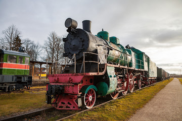 Fototapeta premium Old vintage steam locomotive from XX century Russian empire and USSR
