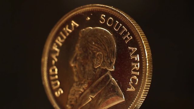 Rotating close up of a gold bullion coin