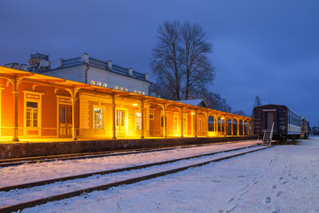 Fototapeta na wymiar Historic wooden railway station. Night illumination. Haapsalu, Estonia.