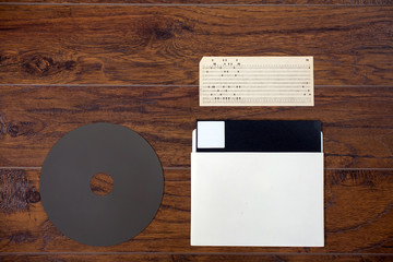 The old 8-inch floppy disk for an IBM old computer, punched card, a comparison 