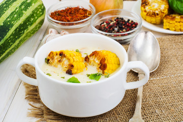 Cream soup with slices of corn grill