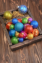 Vintage wooden box with colored bright Christmas tree balls