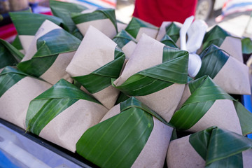 Nasi lemak wrapped with banana leaves and paper for sell in Kota Kinabalu, Sabah Borneo, Malaysia.
