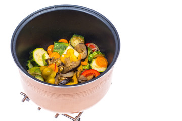 Stewed seasonal vegetables in saucepan. Studio Photo