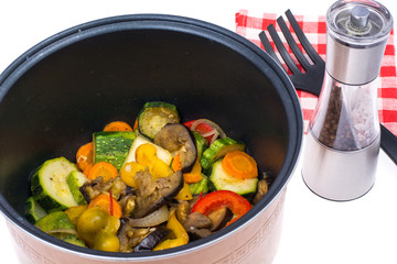 Stewed seasonal vegetables in saucepan. Studio Photo