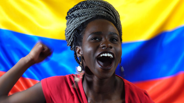 Colombian Young Black Woman Celebrating with Colombia Flag