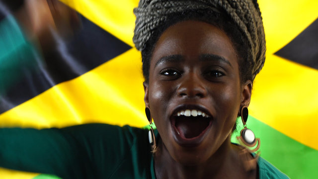 Jamaican Young Black Woman Celebrating with Jamaica Flag
