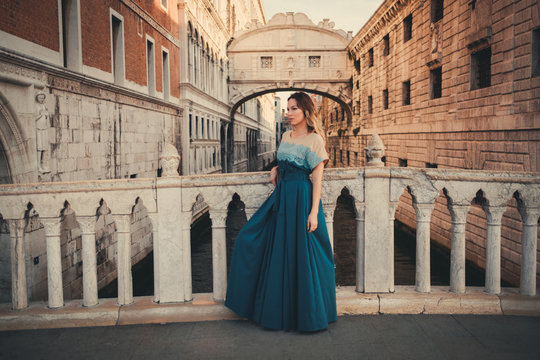 Woman in front of Bridge of Sighs in Venice