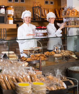 Smiling women at bakery.