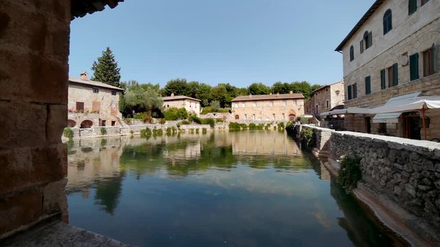 huge pool of thermal water  in picturesque public square in Tuscan village near Siena in Italy