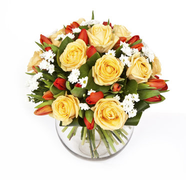 bouquet of yellow roses and red tulips in vase isolated on white background