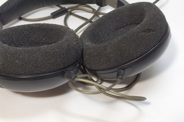 Foam circular earpads of stereo headphones closeup