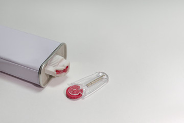 lighter fluid and a set of spare flints in a special storage