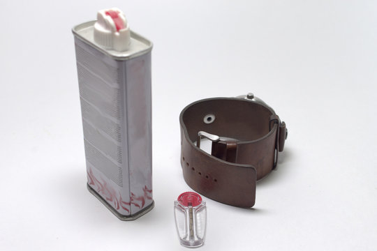 Men's Set Of Wrist Watch, Plastic Flint Holder And Lighter Fluid Can