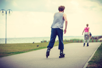 roller skater couple skating outdoor