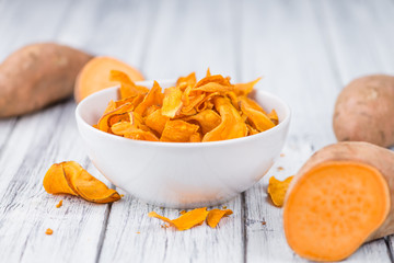 Fresh made Sweet Potato Chips on a rustic background